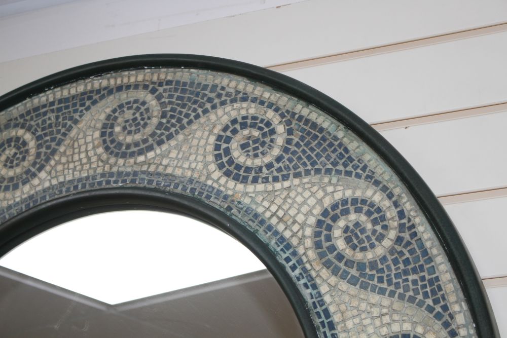 A circular mosaic framed wall mirror, overall diameter 94cm